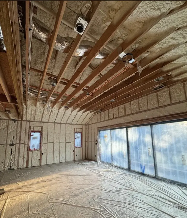 Interior walls and ceiling insulated with spray foam during new construction in Woodside